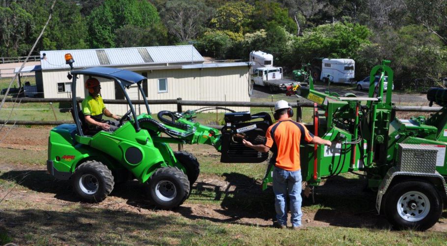Avant loading wood chipper